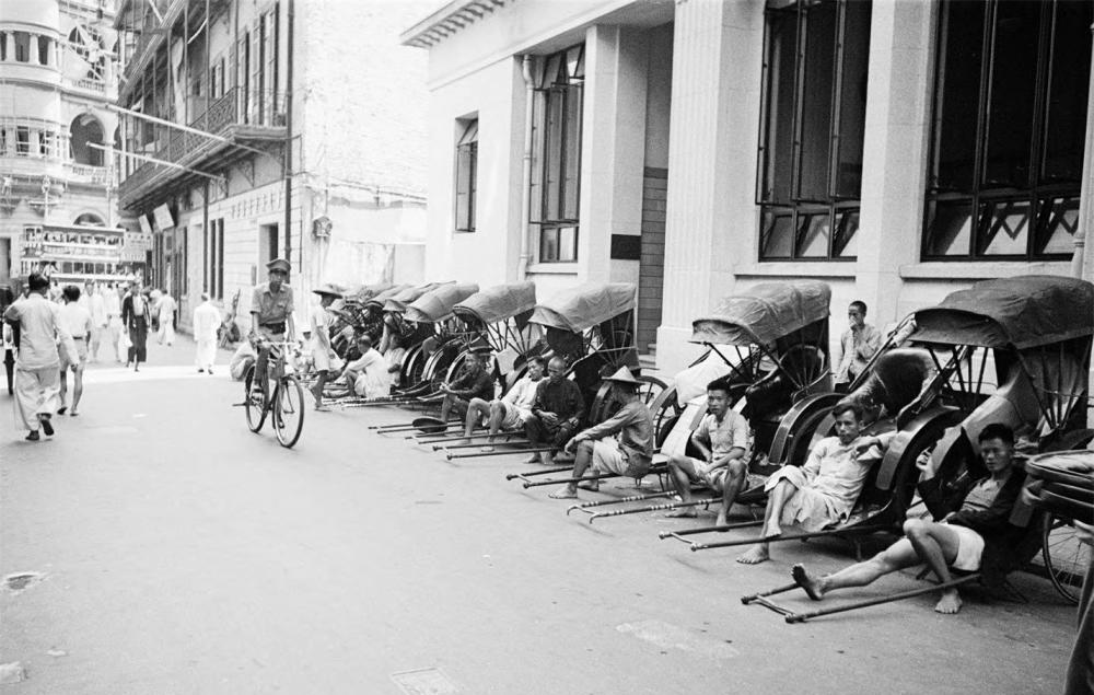 photo2749-(ca. 1941) Hong Kong (China), rickshaws and drivers lined up along building.jpg